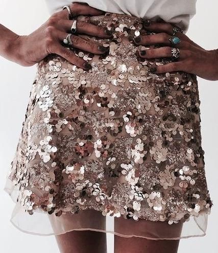 BLACK MODEL IN A SEQUINED SKIRT