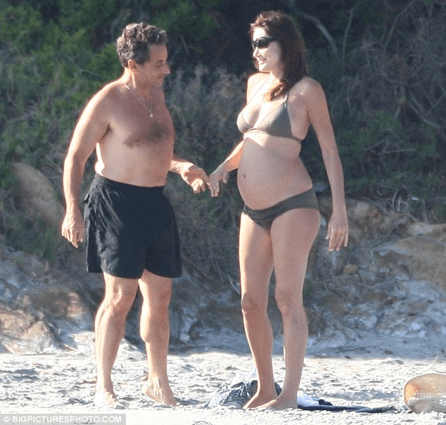 CARLA &amp; HUSBAND NICHOLAS LOOKING AGT HER PREGNANT BELLY