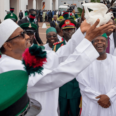 NIGERIAN PRESIDENT BUHARI IN ABUJA, RELEASES A WHITE DOVE, IN CELEBRATION OF NIGERIA`S 57TH YEAR OF INDEPENDENCE