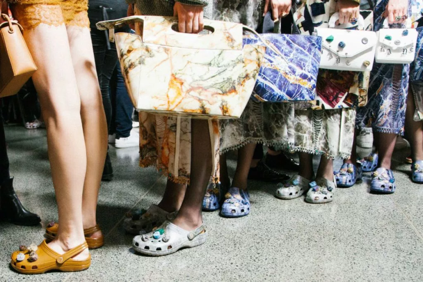BALENCIAGA MODELS WEARING CREATIVE DIRECTOR,CHRISTOPHER KANE`S CROCS WITH THEIR HANDBAGS .png.jpg