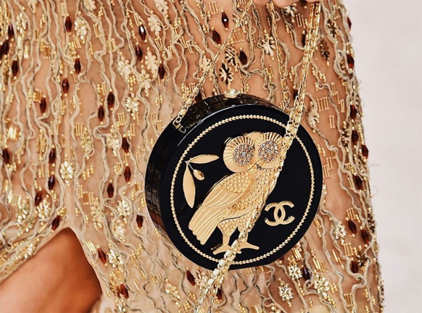 CHANEL SS18 MODEL WEARING A HEAVILY GOLD BEADED GOWN AND A CIRCLE HANDBAG FEATURING AN OWL – WITH THE INTERLOCKING Cs #2