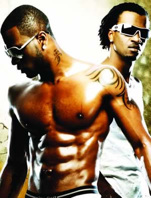 NIGERIAN MALE ARTIST PSQUARE (PAUL AND PETER OKOYE) FLEXING THEIR MUSCLES PHOTO