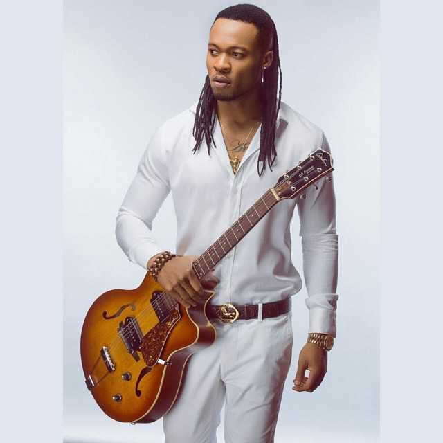 NIGERIAN MALE ARTISTS FLAVOUR WITH HIS GUITAR PHOTO.png