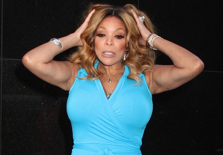 WENDY WILLIAMS CONFUSED IN A BLUE DRESS